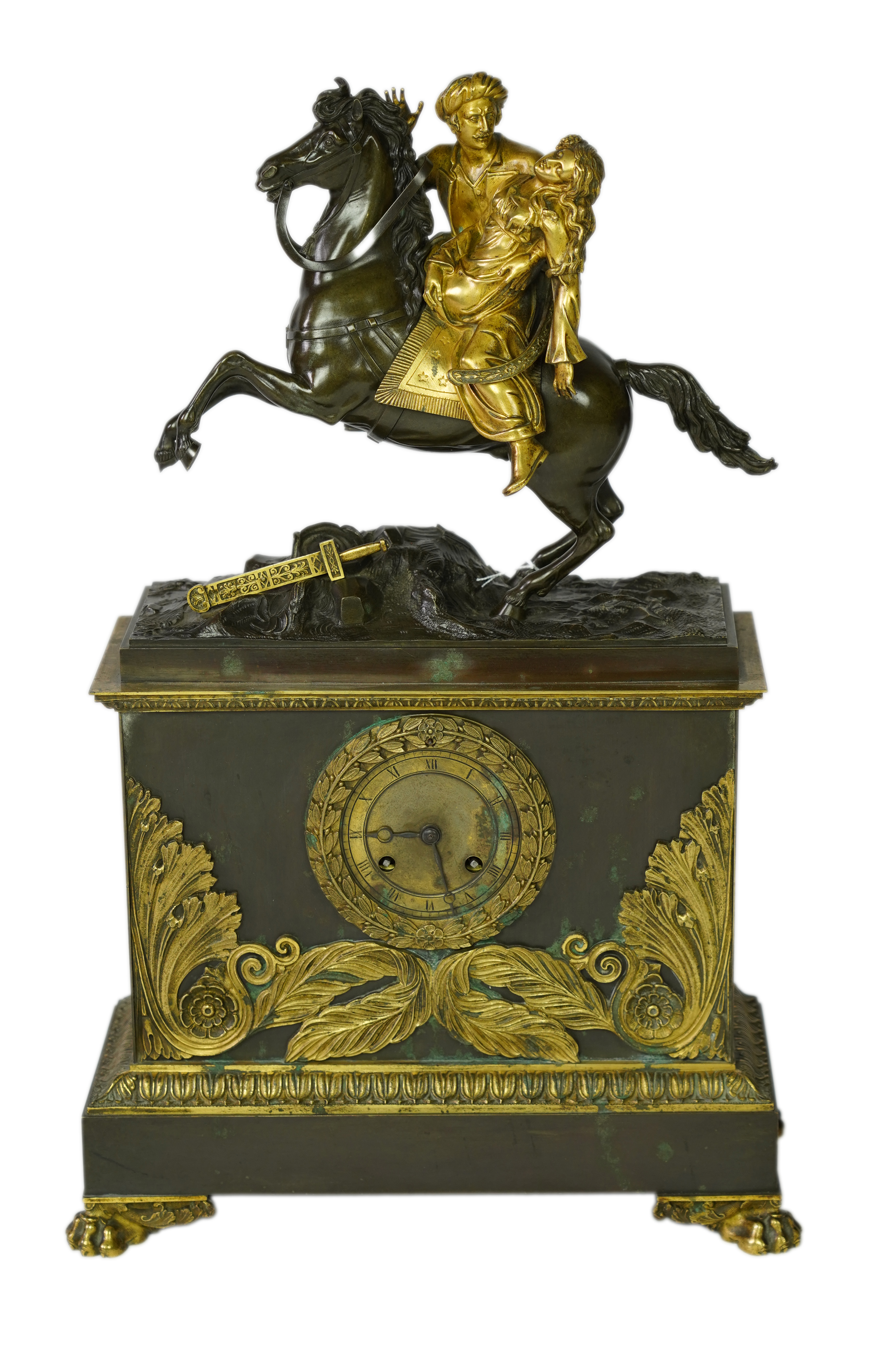 A late nineteenth century brass and bronze cased clock, mounted with a part gilt bronze of a mounted Turkish soldier and woman